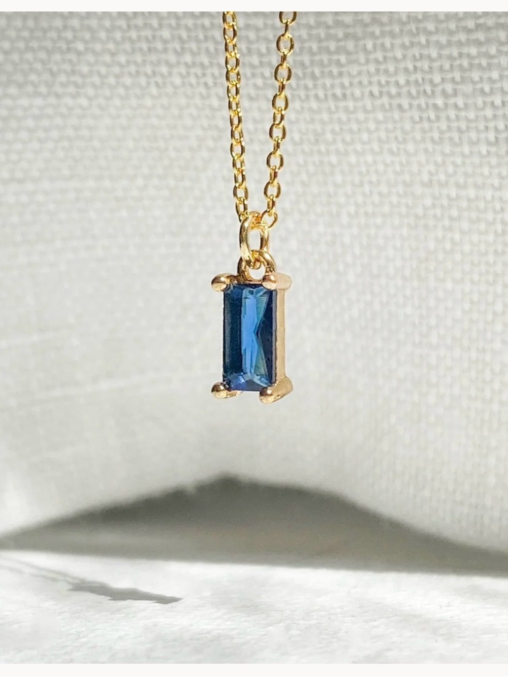 Llume Taylor Necklace- gold chain with sapphire blue pendant